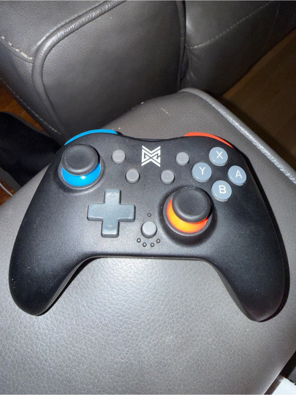 Brand new Black Wireless Game Controller with Blue & Orange Accents